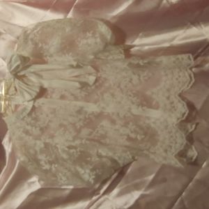 Pastel brand off white lace top with bow and back zip.